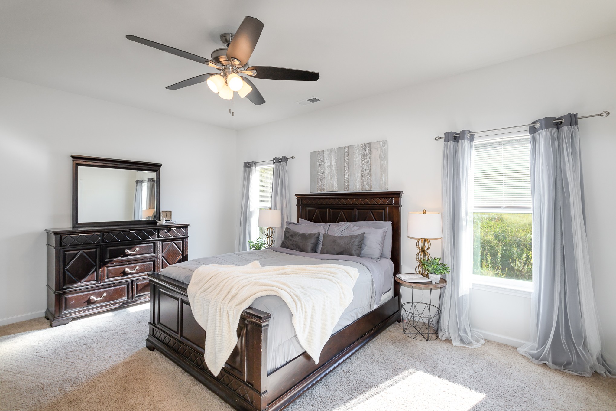 525 Burchell Lane Columbia, TN 38401 - Photo 19 of 35 a bedroom with a large bed and a chandelier