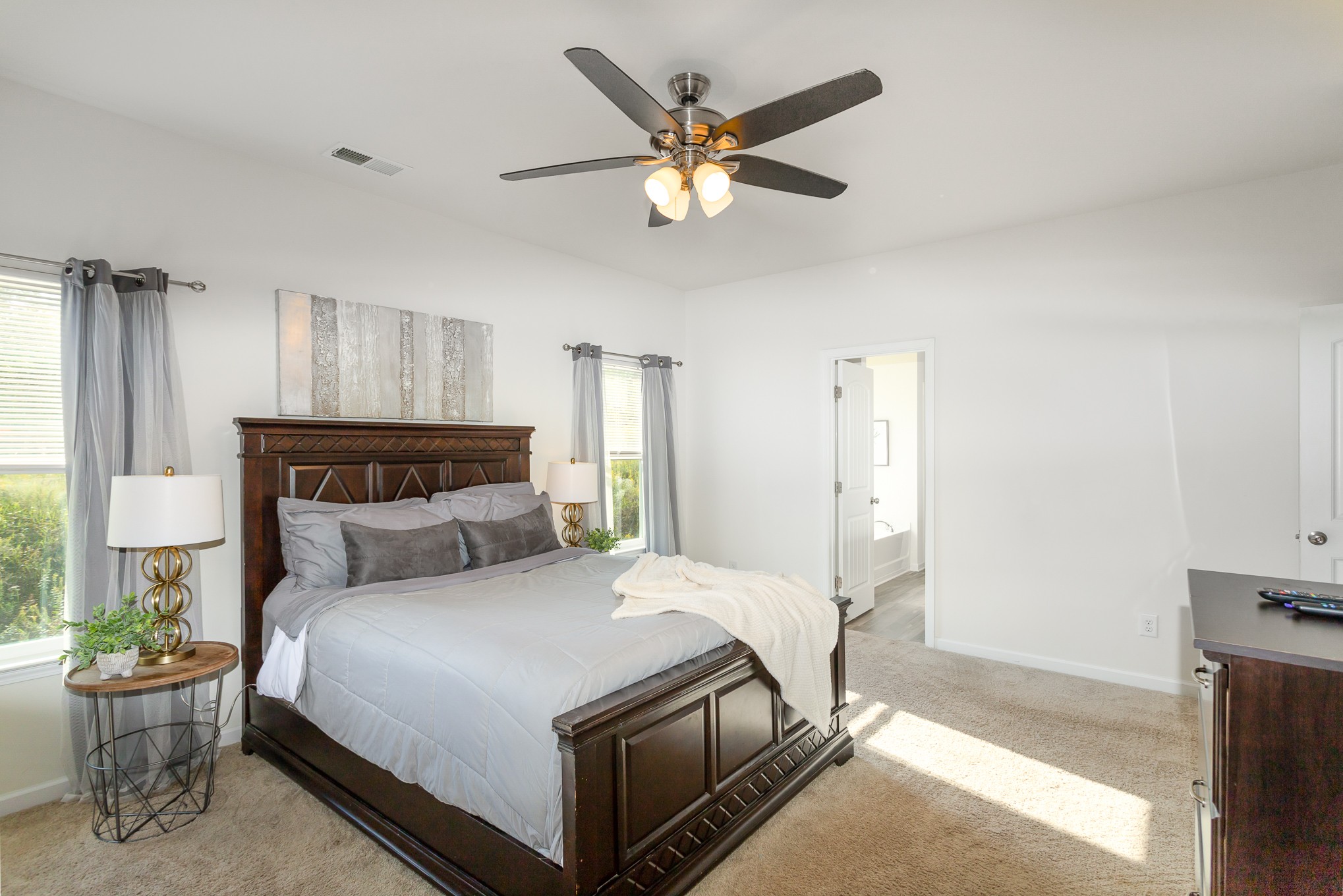 525 Burchell Lane Columbia, TN 38401 - Photo 20 of 35 a bedroom with a large bed and a chandelier