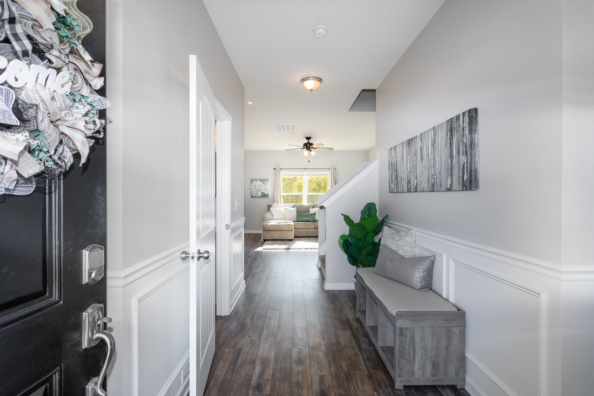 525 Burchell Lane Columbia, TN 38401 - Photo 4 of 35 a view of a hallway to a livingroom with wooden floor and a ceiling fan
