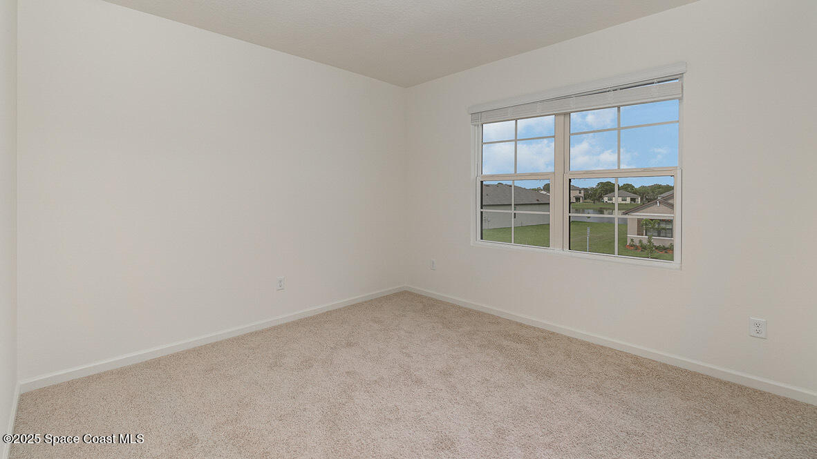 598 Ganley Street Palm Bay, FL 32908 - Photo 12 of 25 an empty room with a window