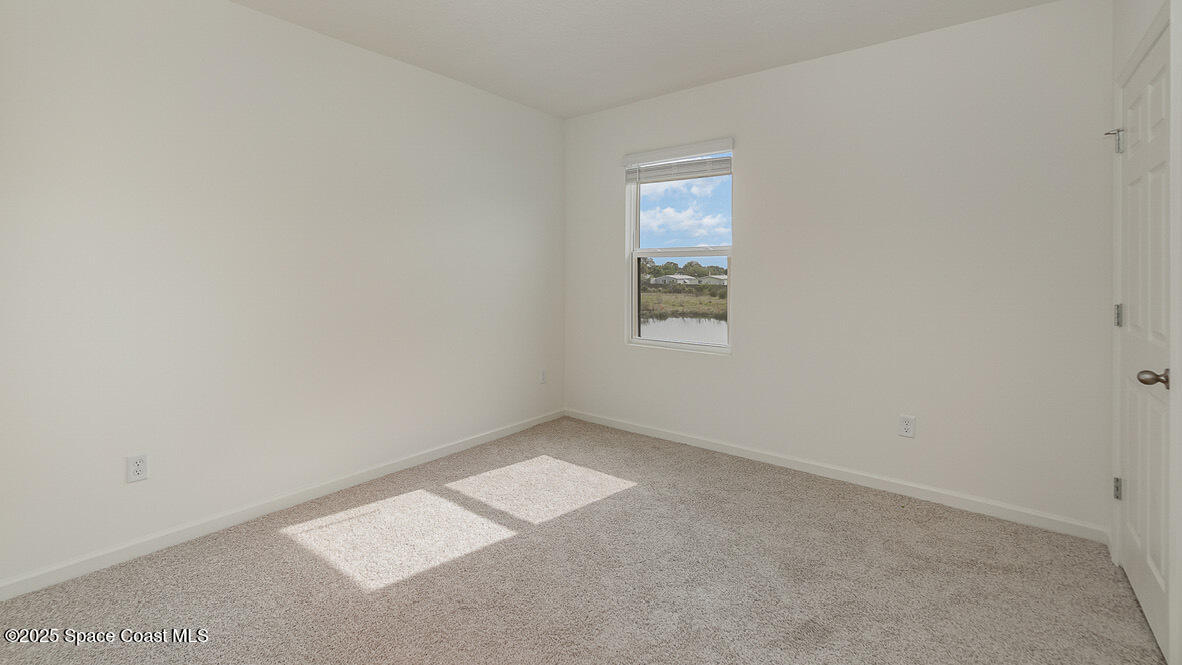 598 Ganley Street Palm Bay, FL 32908 - Photo 15 of 25 an empty room with a window