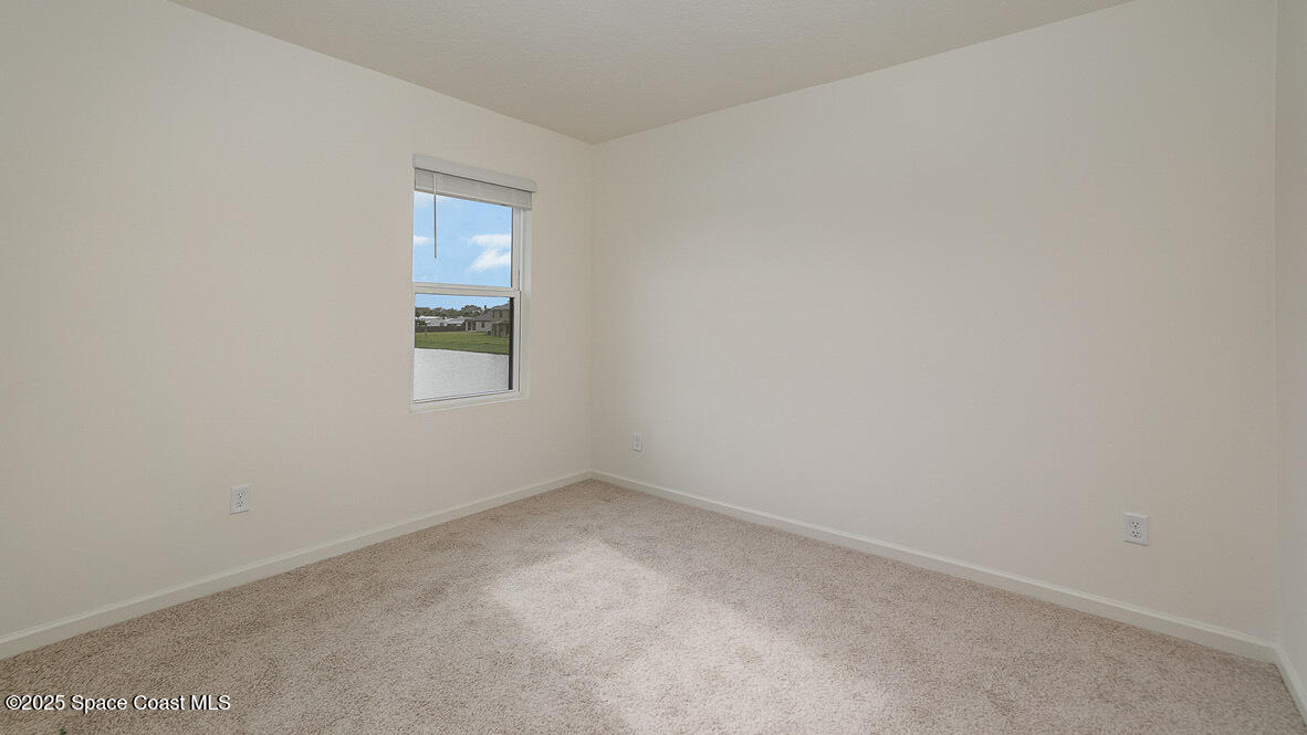 598 Ganley Street Palm Bay, FL 32908 - Photo 16 of 25 an empty room with a window
