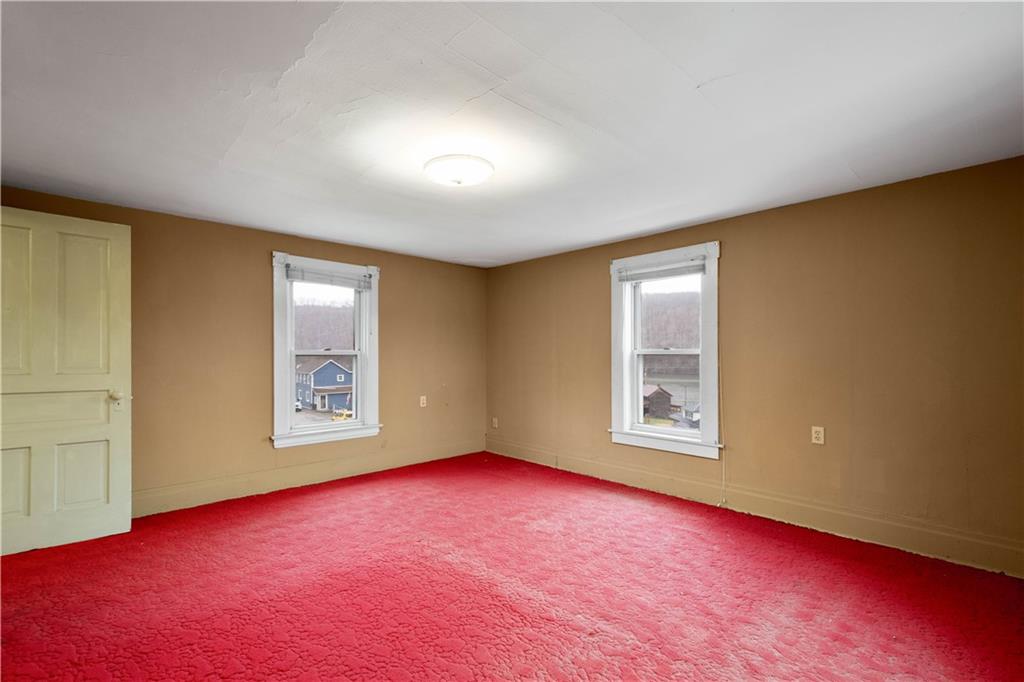 107 Center Street Millsboro, PA 15348 - Photo 23 of 34 an empty room with windows