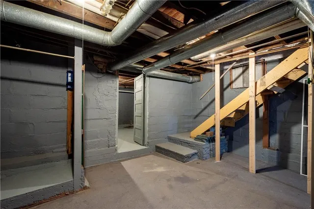 an aerial view of a house with swimming pool and lake view