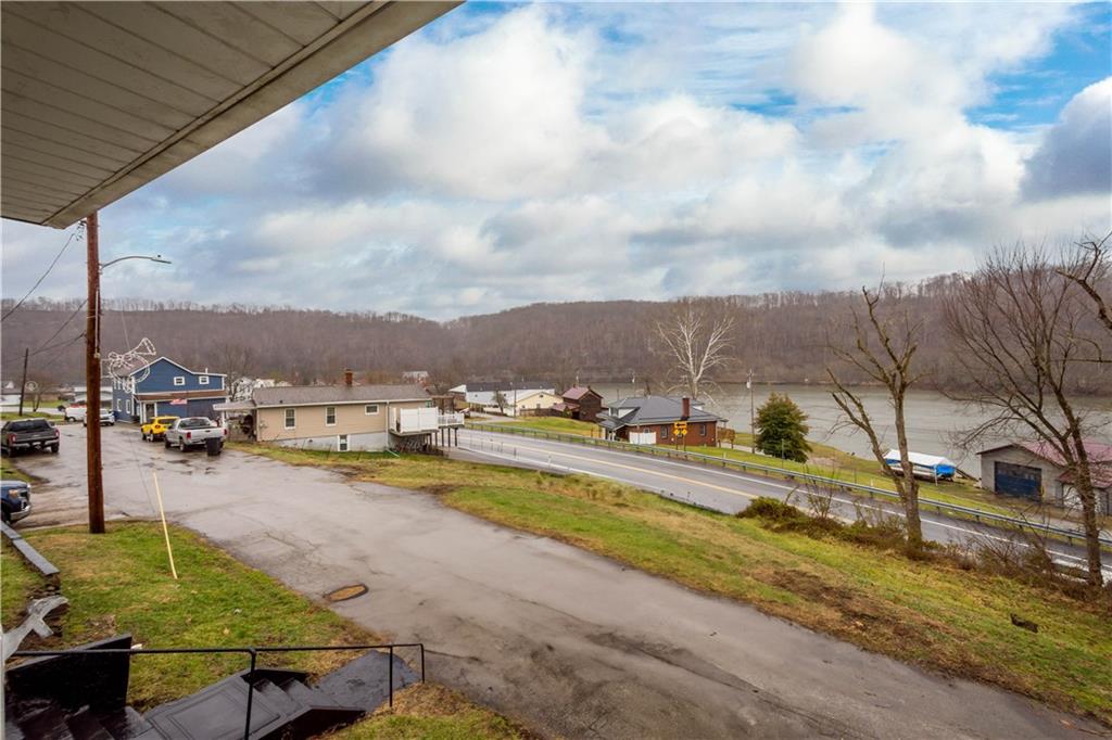 107 Center Street Millsboro, PA 15348 - Photo 29 of 34 an aerial view of a house with swimming pool and lake view