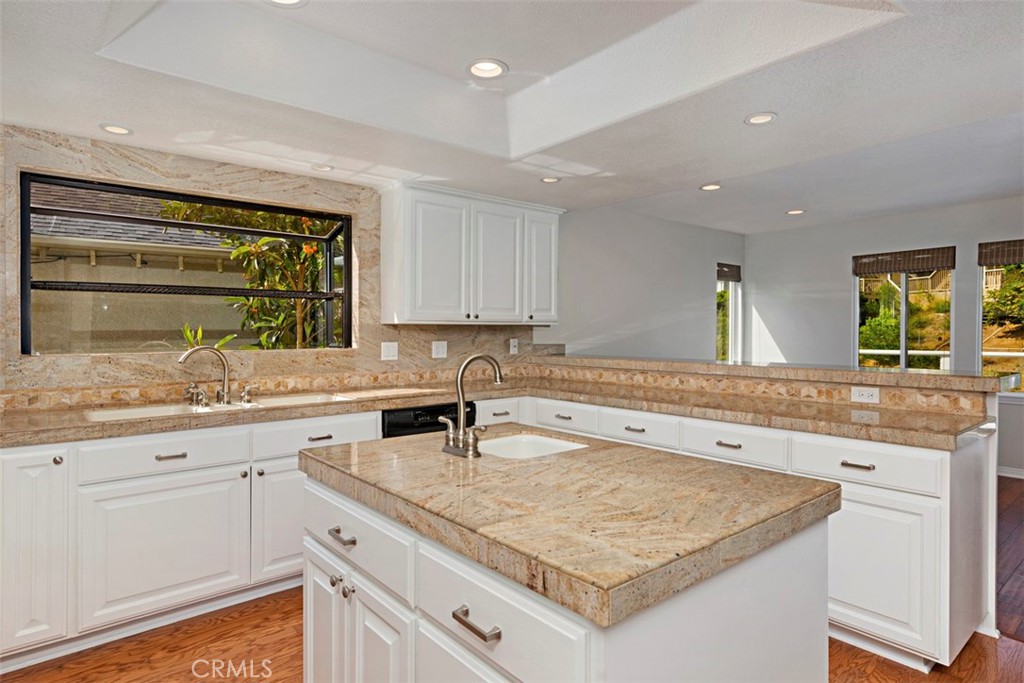33852 Orilla Road Dana Point, CA 92629 - Photo 13 of 49 a kitchen with a sink stove and cabinets