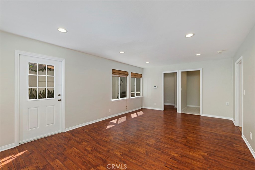 33852 Orilla Road Dana Point, CA 92629 - Photo 19 of 49 a view of an empty room with wooden floor and windows