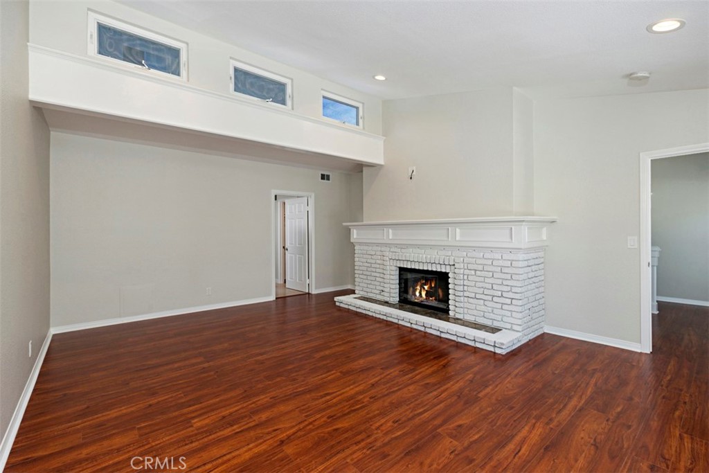 33852 Orilla Road Dana Point, CA 92629 - Photo 21 of 49 a view of a livingroom with wooden floor and a fireplace