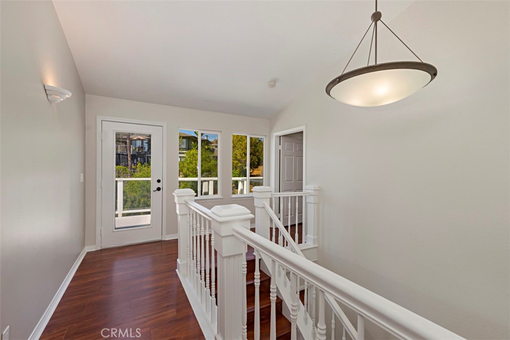 33852 Orilla Road Dana Point, CA 92629 - Photo 26 of 49 a view of a room with wooden floor windows and a chandelier