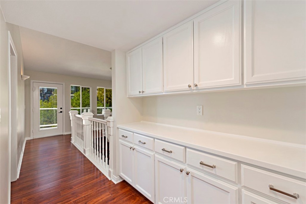 33852 Orilla Road Dana Point, CA 92629 - Photo 32 of 49 a kitchen with white cabinets and sink