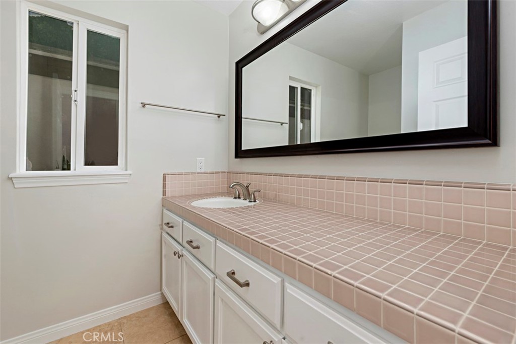 33852 Orilla Road Dana Point, CA 92629 - Photo 35 of 49 a bathroom with a sink and a mirror