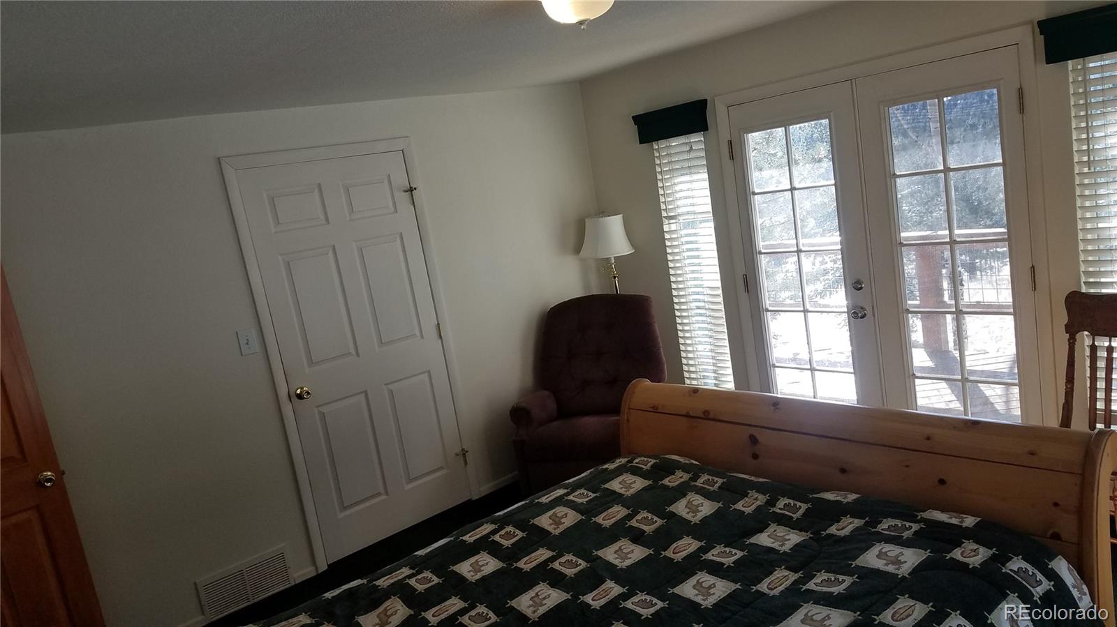 67 Hold Up Street Bailey, CO 80421 - Photo 25 of 25 a bedroom with a bed and a window