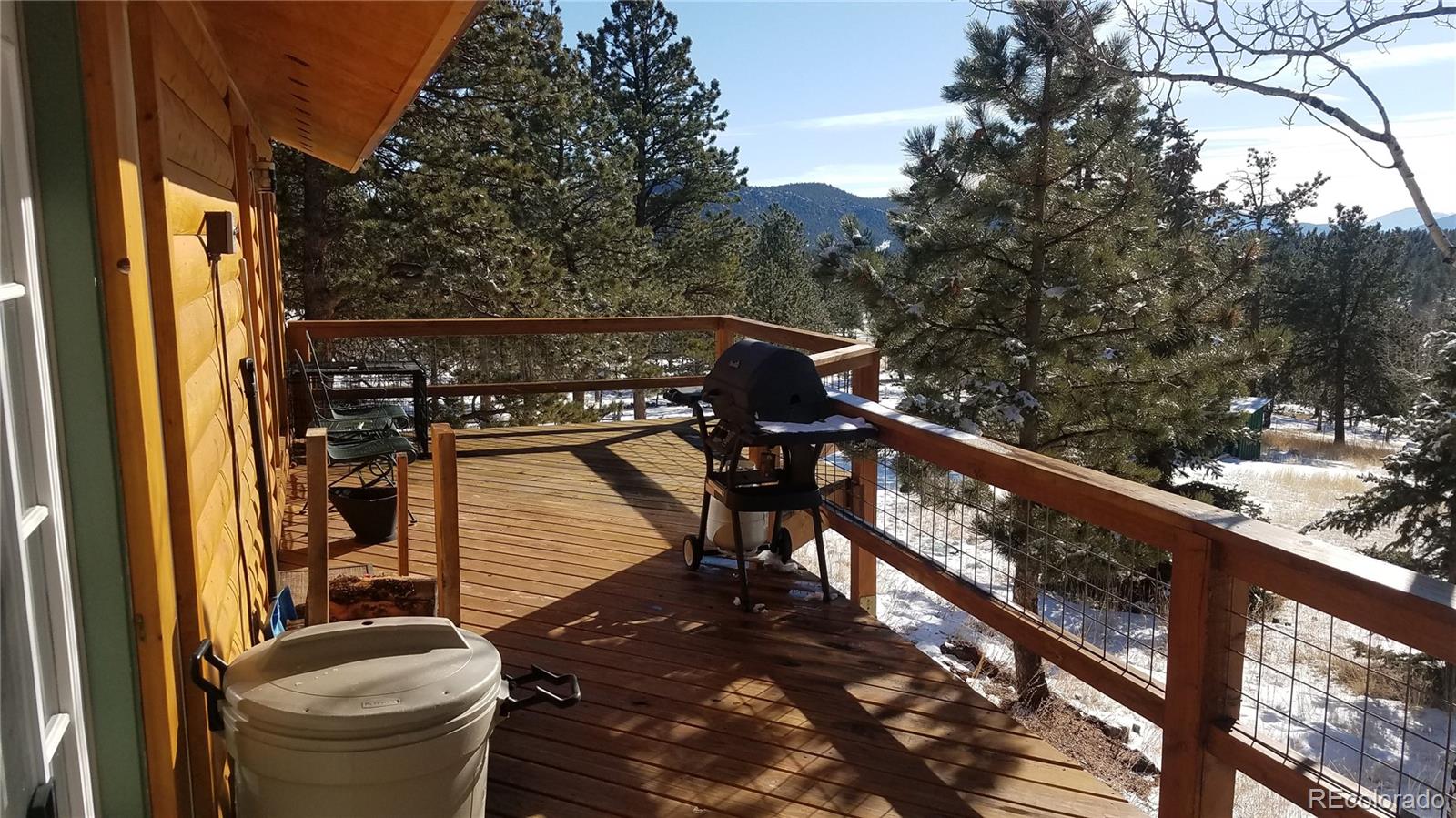 67 Hold Up Street Bailey, CO 80421 - Photo 7 of 25 a view of a balcony with an outdoor seating