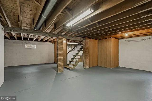a view of empty room with wooden ceiling