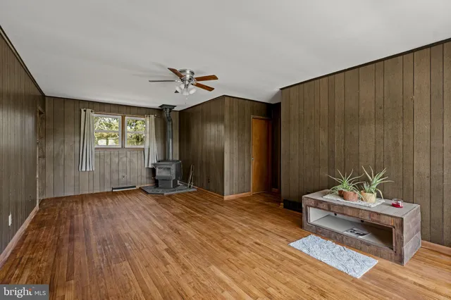 a bedroom with furniture and window