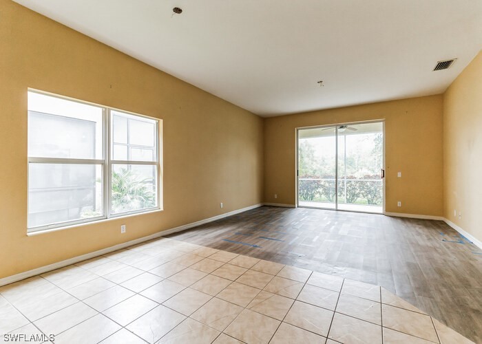 8981 Falcon Pointe Loop Fort Myers, FL 33912 - Photo 13 of 25 a view of an empty room with a window