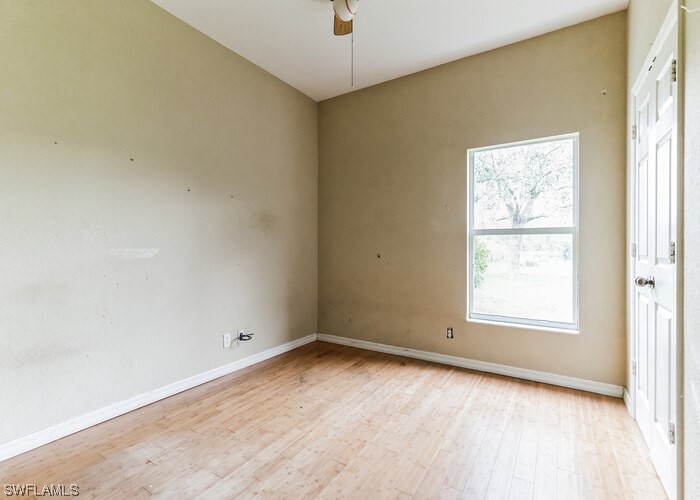 8981 Falcon Pointe Loop Fort Myers, FL 33912 - Photo 15 of 25 an empty room with a window