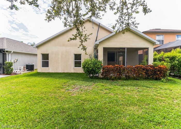 8981 Falcon Pointe Loop Fort Myers, FL 33912 - Photo 2 of 25 a front view of house with yard and green space