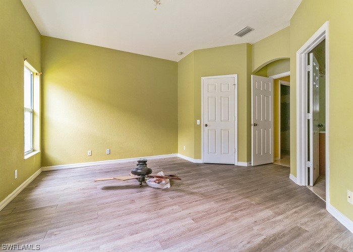 8981 Falcon Pointe Loop Fort Myers, FL 33912 - Photo 21 of 25 a view of a livingroom with wooden floor and a window