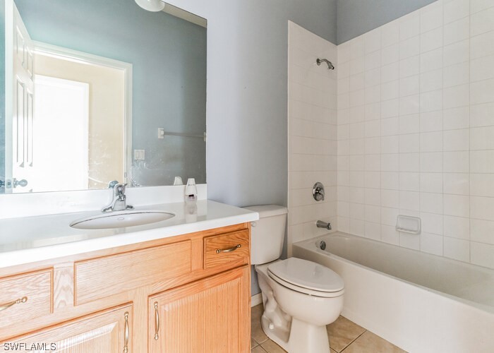 8981 Falcon Pointe Loop Fort Myers, FL 33912 - Photo 23 of 25 a bathroom with a sink a toilet and shower