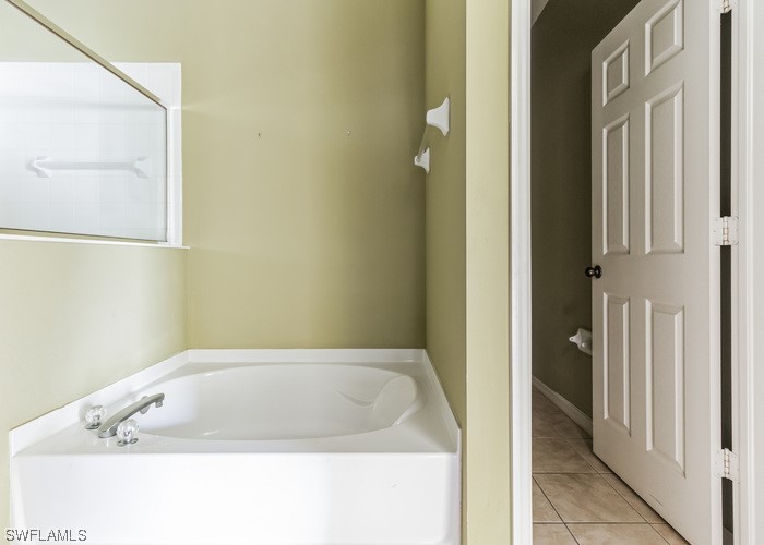 8981 Falcon Pointe Loop Fort Myers, FL 33912 - Photo 25 of 25 a bathroom with a bathtub