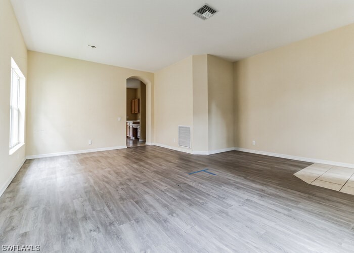 8981 Falcon Pointe Loop Fort Myers, FL 33912 - Photo 8 of 25 a view of empty room with wooden floor