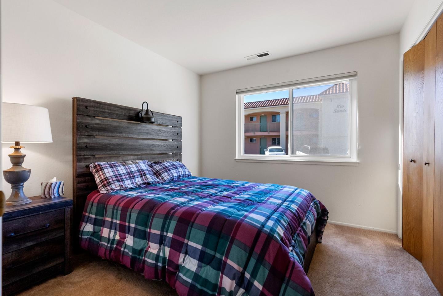 135 Stephen Road Aptos, CA 95003 - Photo 20 of 44 a bedroom with a bed and a window