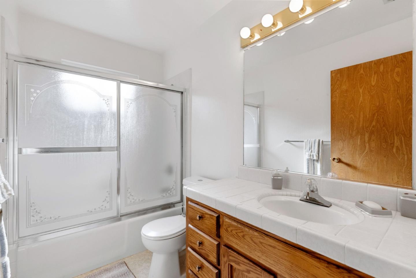 135 Stephen Road Aptos, CA 95003 - Photo 21 of 44 a bathroom with a sink a toilet and shower