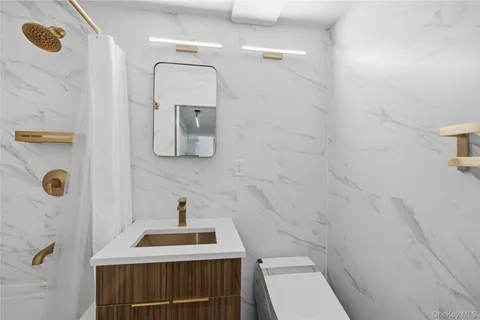 a bathroom with a sink and shower