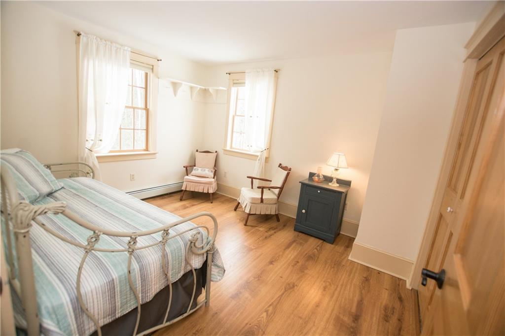 76 Gurnet Landing Road Harpswell, ME 04079 - Photo 22 of 35 This sunny bedroom has laminate floors.