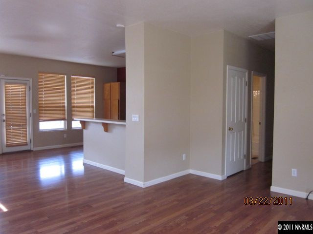 3025 Andrea Street Reno, NV 89503 - Photo 3 of 11 wooden floor in an empty room with a window