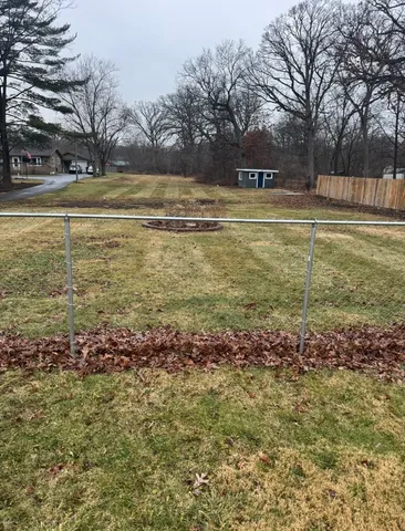 a view of a swimming pool with an outdoor space and seating area