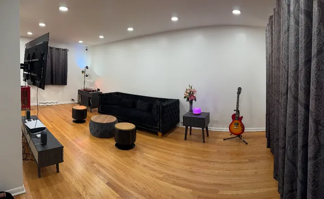 a living room with furniture and a flat screen tv