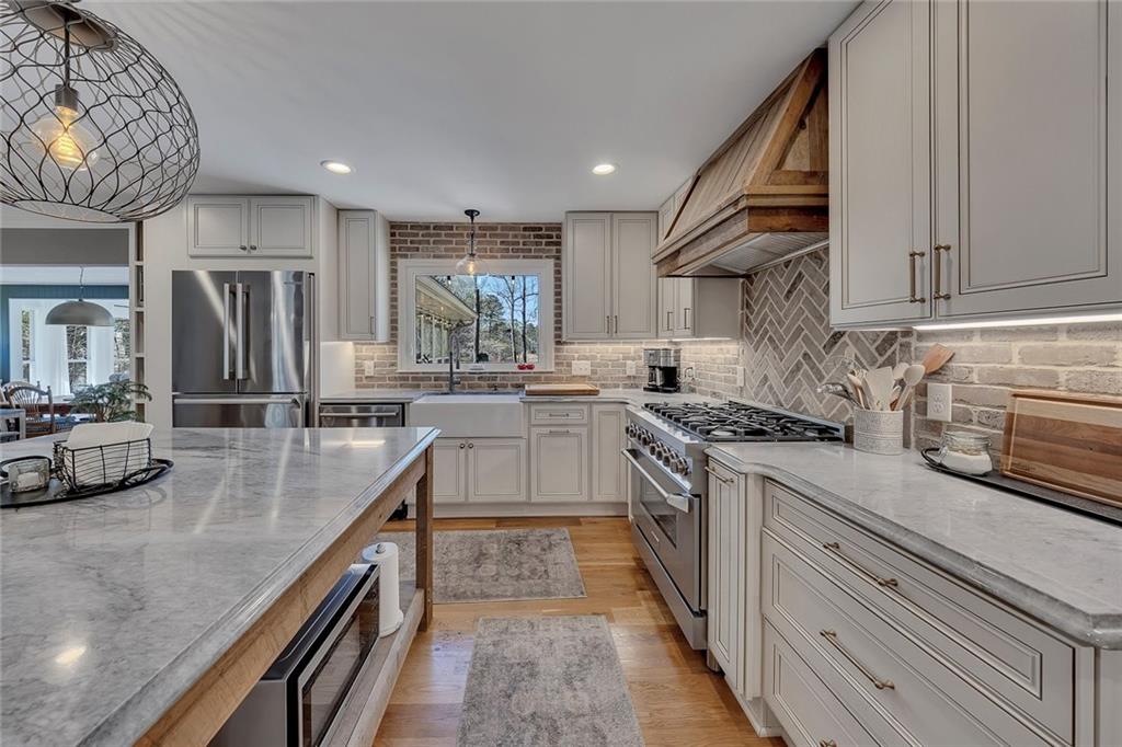 1424 Ridgeway Drive Northwest Acworth, GA 30102 - Photo 12 of 38 a kitchen with stainless steel appliances granite countertop a sink and stove