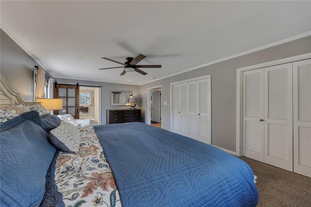 1424 Ridgeway Drive Northwest Acworth, GA 30102 - Photo 22 of 38 a bed room with a bed furniture and a fireplace