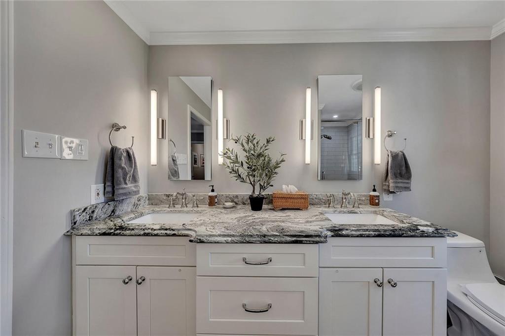 1424 Ridgeway Drive Northwest Acworth, GA 30102 - Photo 24 of 38 a bathroom with double vanity sinks and a mirror