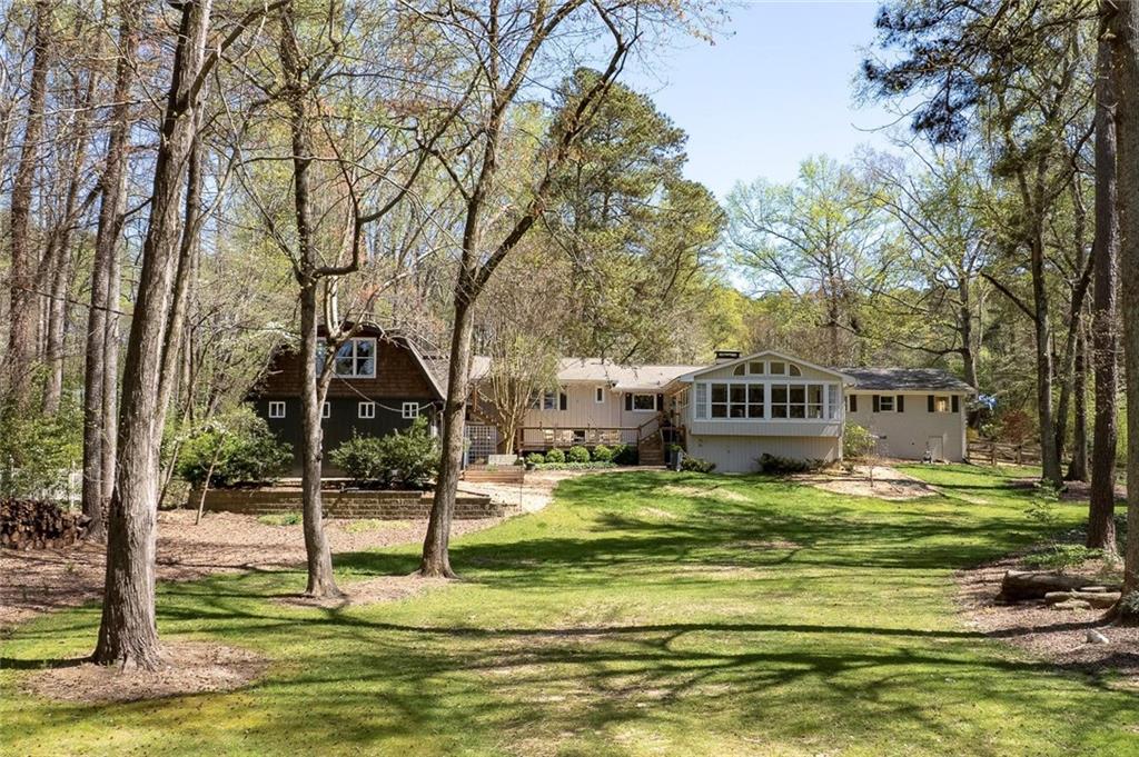1424 Ridgeway Drive Northwest Acworth, GA 30102 - Photo 30 of 38 a swimming pool with trees in the background
