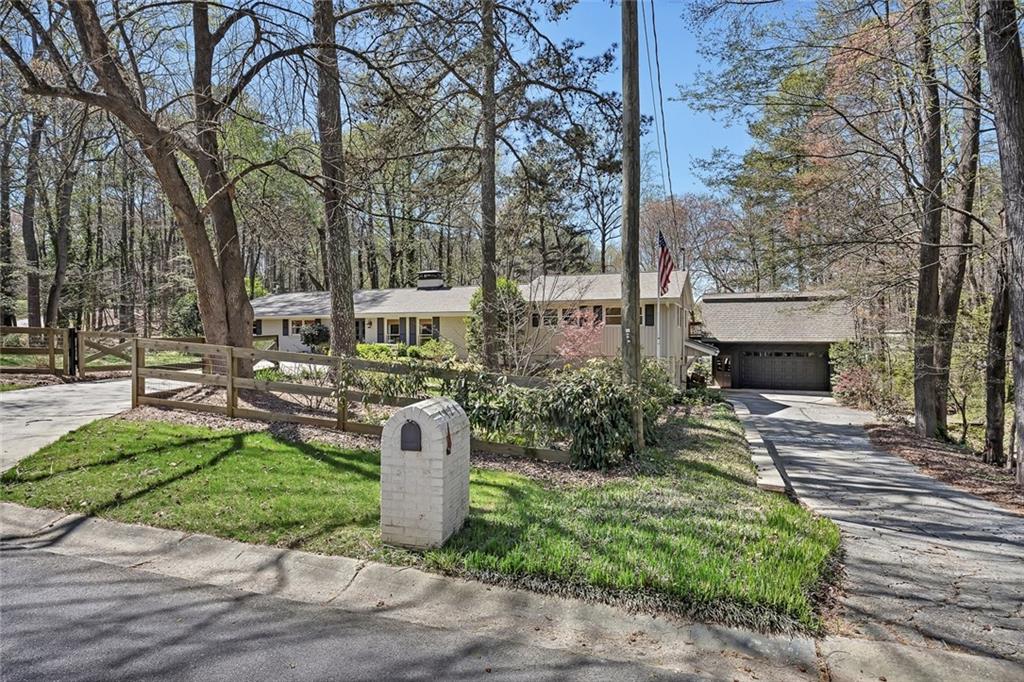 1424 Ridgeway Drive Northwest Acworth, GA 30102 - Photo 7 of 38 a front view of a house with a yard and trees