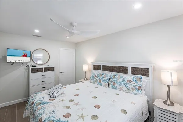 a large white bed in a white room