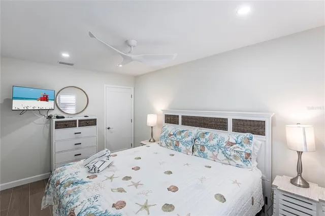 a large white bed in a white room