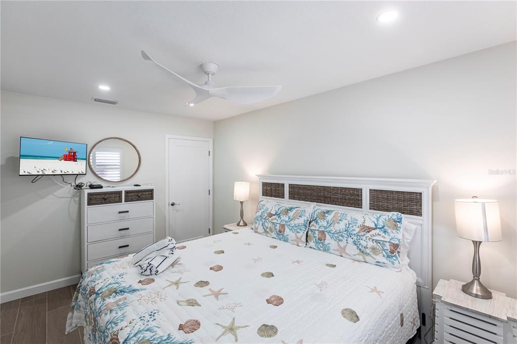 6020 Midnight Pass Road, Unit 29 Sarasota, FL 34242 - Photo 11 of 16 a large white bed in a white room