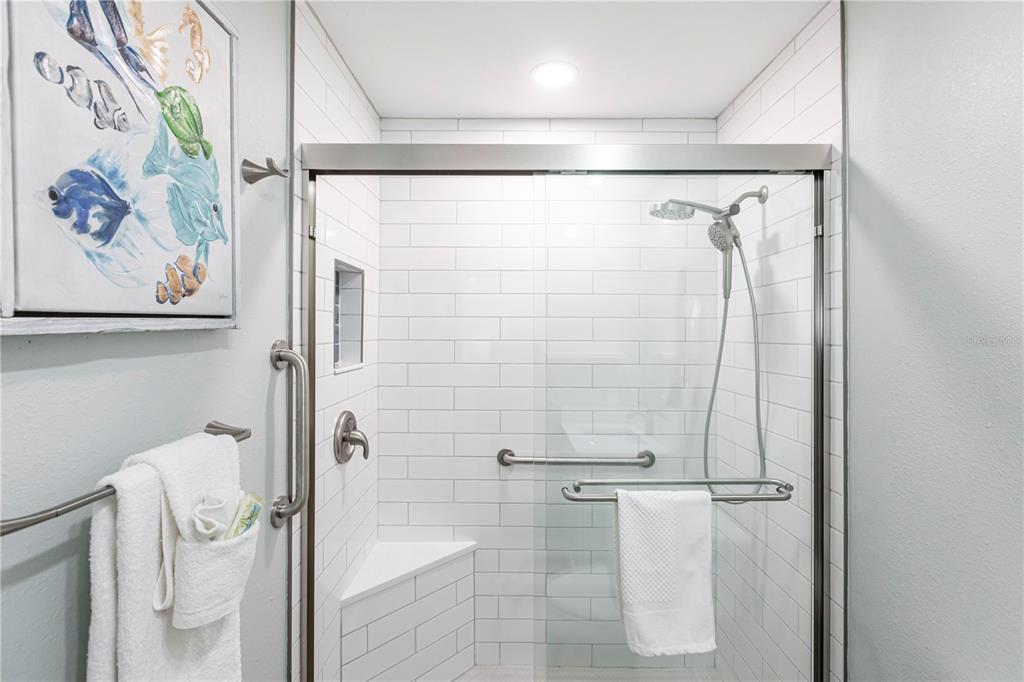 6020 Midnight Pass Road, Unit 29 Sarasota, FL 34242 - Photo 13 of 16 a bathroom with a shower