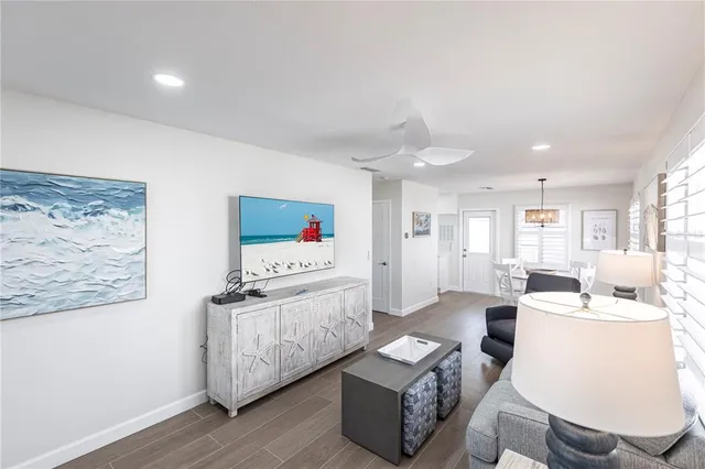 a living room with furniture and white walls