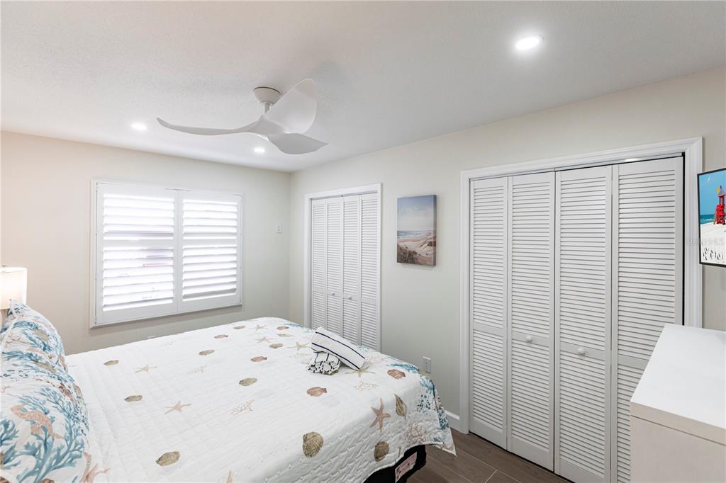 6020 Midnight Pass Road, Unit 29 Sarasota, FL 34242 - Photo 10 of 16 a bedroom with a bed and a window