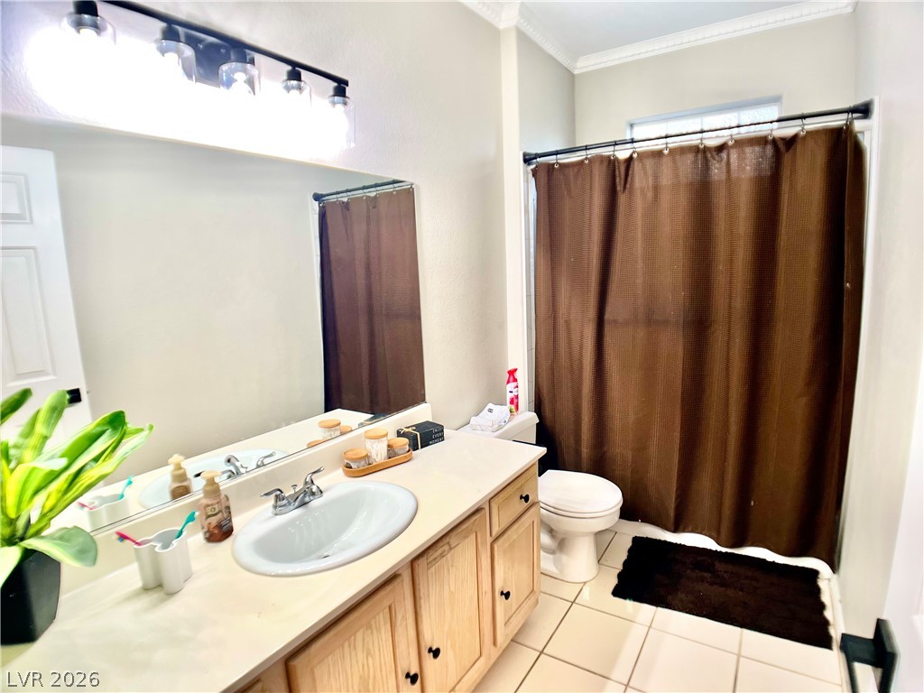 2050 West Warm Springs Road, Unit 321 Henderson, NV 89014 - Photo 17 of 28 This bathroom features a functional layout, with a spacious vanity and ample lighting.