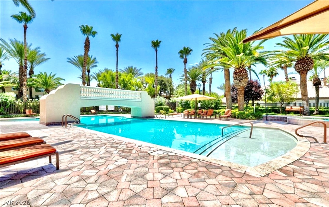 2050 West Warm Springs Road, Unit 321 Henderson, NV 89014 - Photo 25 of 28 Relax and unwind in this inviting outdoor oasis featuring a sparkling pool and spa.