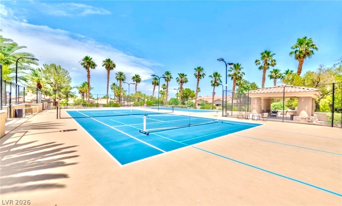 2050 West Warm Springs Road, Unit 321 Henderson, NV 89014 - Photo 26 of 28 Enjoy the vibrant tennis court, a perfect setting for active outdoor living.