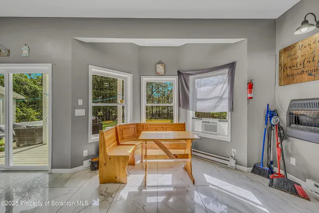 a view of a livingroom with furniture and windows