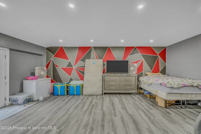 a bedroom with a bed and cabinets