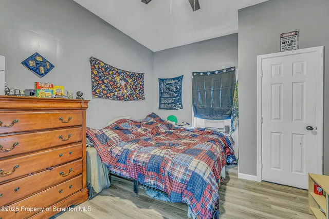 a bedroom with a bed and a dresser